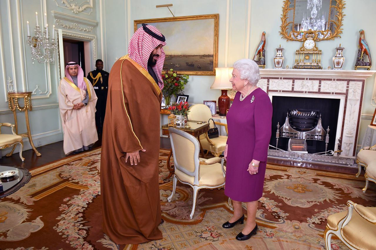 Queen Elizabeth greets Mohammed bin Salman, the Crown Prince of Saudi Arabia, at Buckingham Palace in London on March 7, 2018.