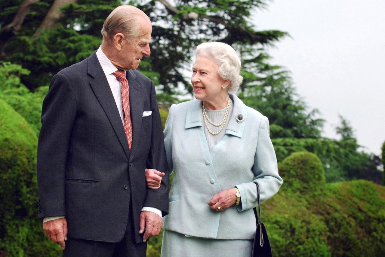 Queen Elizabeth and Prince Philip, Duke of Edinburgh, walk at Broadlands in Hampshire on November 18, 2007. 