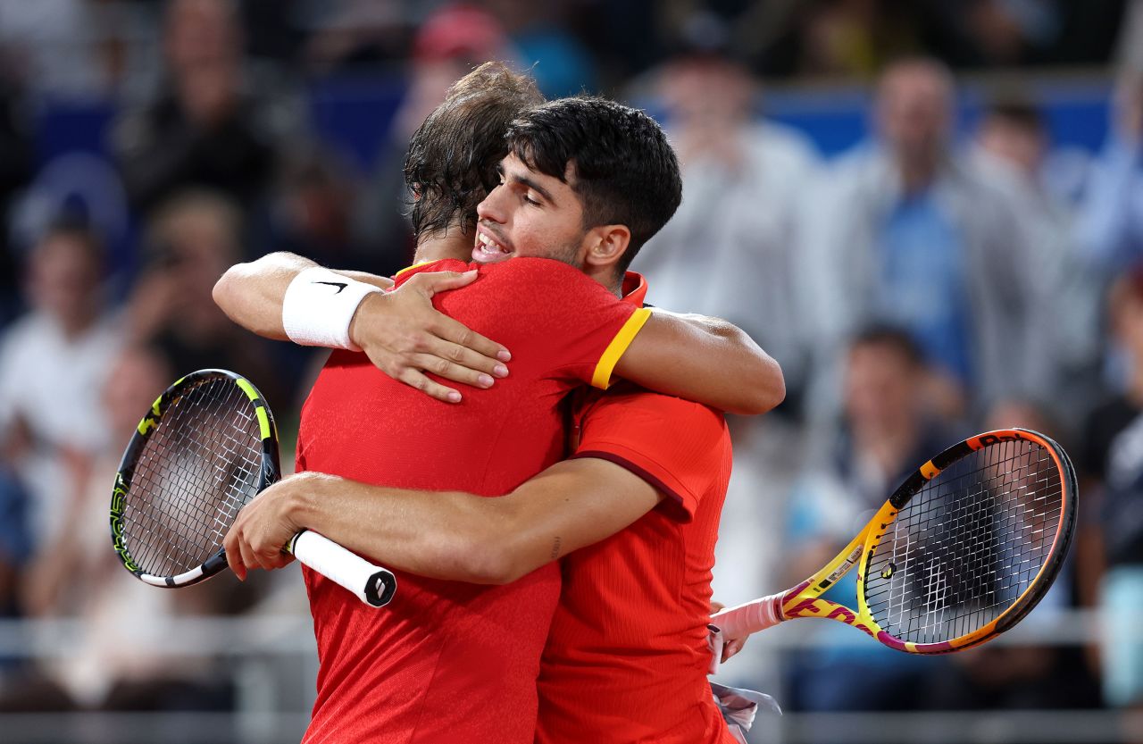 Rafael Nadal, left, and partner Carlos Alcaraz embrace during the match. 