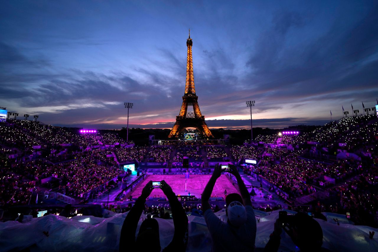 People attend a beach volleyball match at Eiffel Tower Stadium in Paris on July 27. 