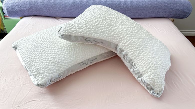 The different shapes of the Nest Bedding Easy Breather pillows on the bed