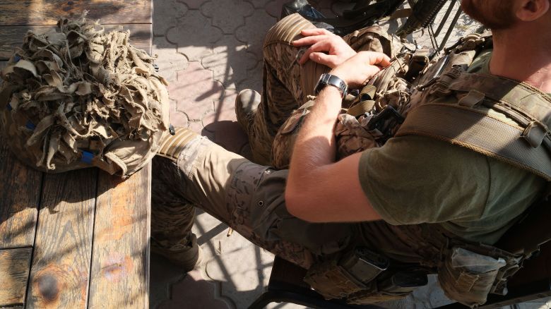 A group of Ukrainian soldiers rest after completing a long missing in Russia's Kursk region.