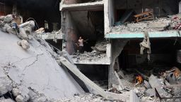 Palestinian children search through the rubble of their home a day after an operation by the Israeli Special Forces in the Nuseirat camp, in the central Gaza Strip on June 9.