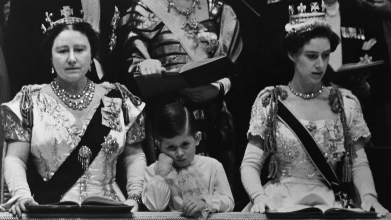 Prince Charles watches his mother's coronation. On the left is his grandmother, the Queen Mother. At right is his aunt, Princess Margaret.