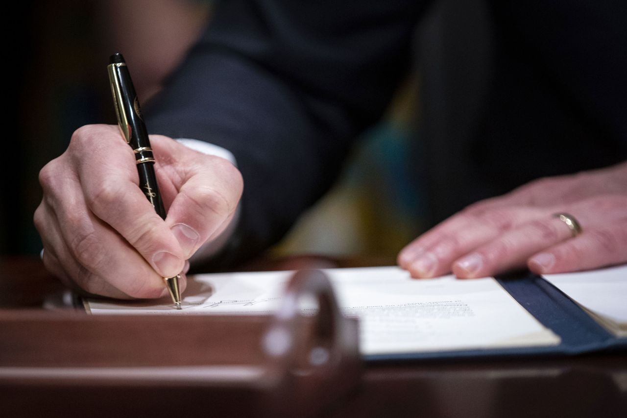 Virginia Gov. Glenn Youngkin signs executive actions in the Virginia State Capitol in Richmond, Virginia, on January 15.