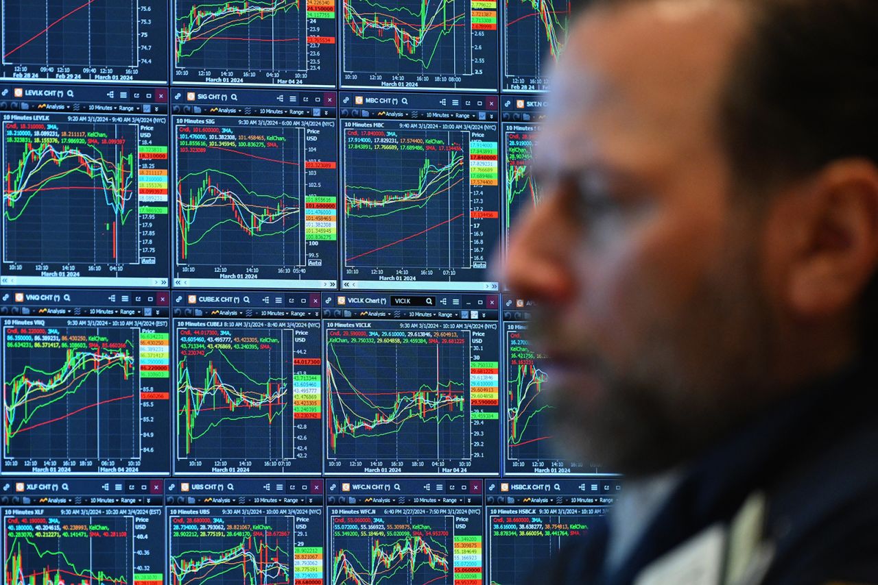 A trader works on the floor of the New York Stock Exchange during morning trading on March 4.