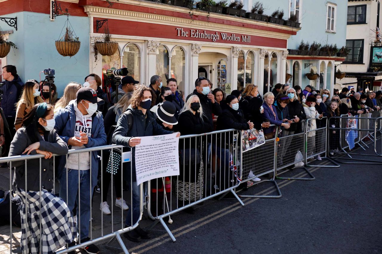 People are seen outside the entrance to Windsor Castle on Saturday. 