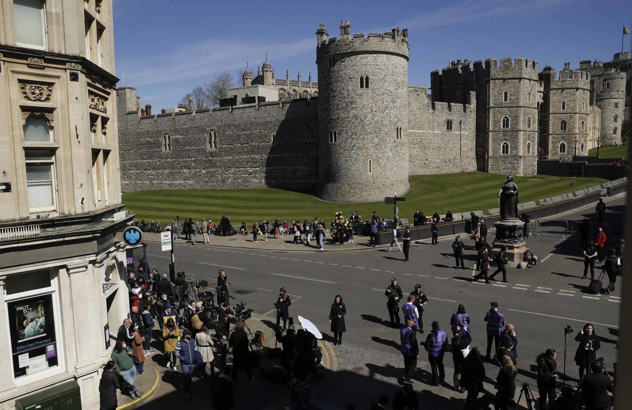 People gather ahead of the funeral of Britain's Prince Philip in Windsor, England, on Saturday April 17. 