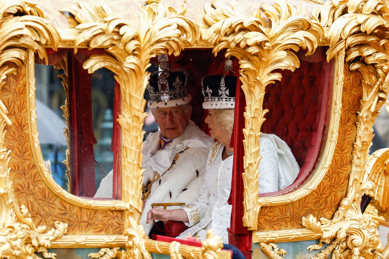 King Charles III and Queen Camilla leave Westminster Abbey in the Gold State Coach.