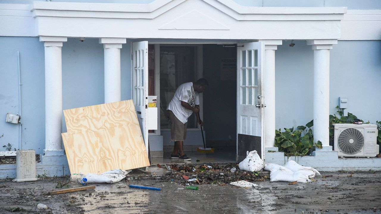 A man clears water from a damaged restaurant after the passage of Hurricane Beryl in Hastings, Christ Church, Barbados, on Monday.