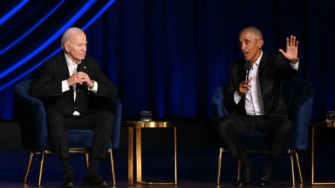 President Joe Biden listens as former President Barack Obama speaks onstage during a campaign fundraiser at the Peacock Theater in Los Angeles on June 15.