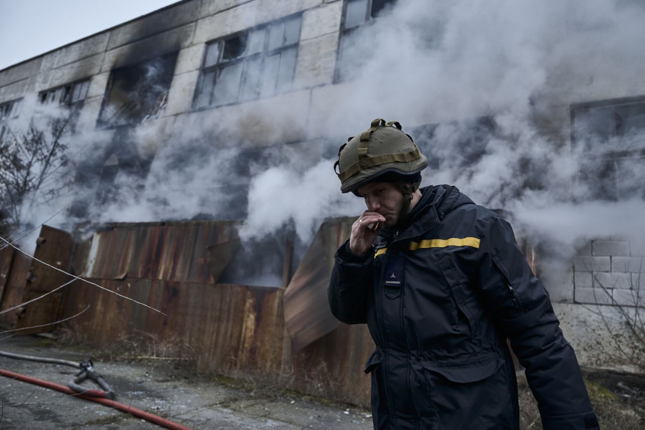 A Ukrainian State Emergency Service firefighter smokes after Russian shelling in Kherson, on Sunday.