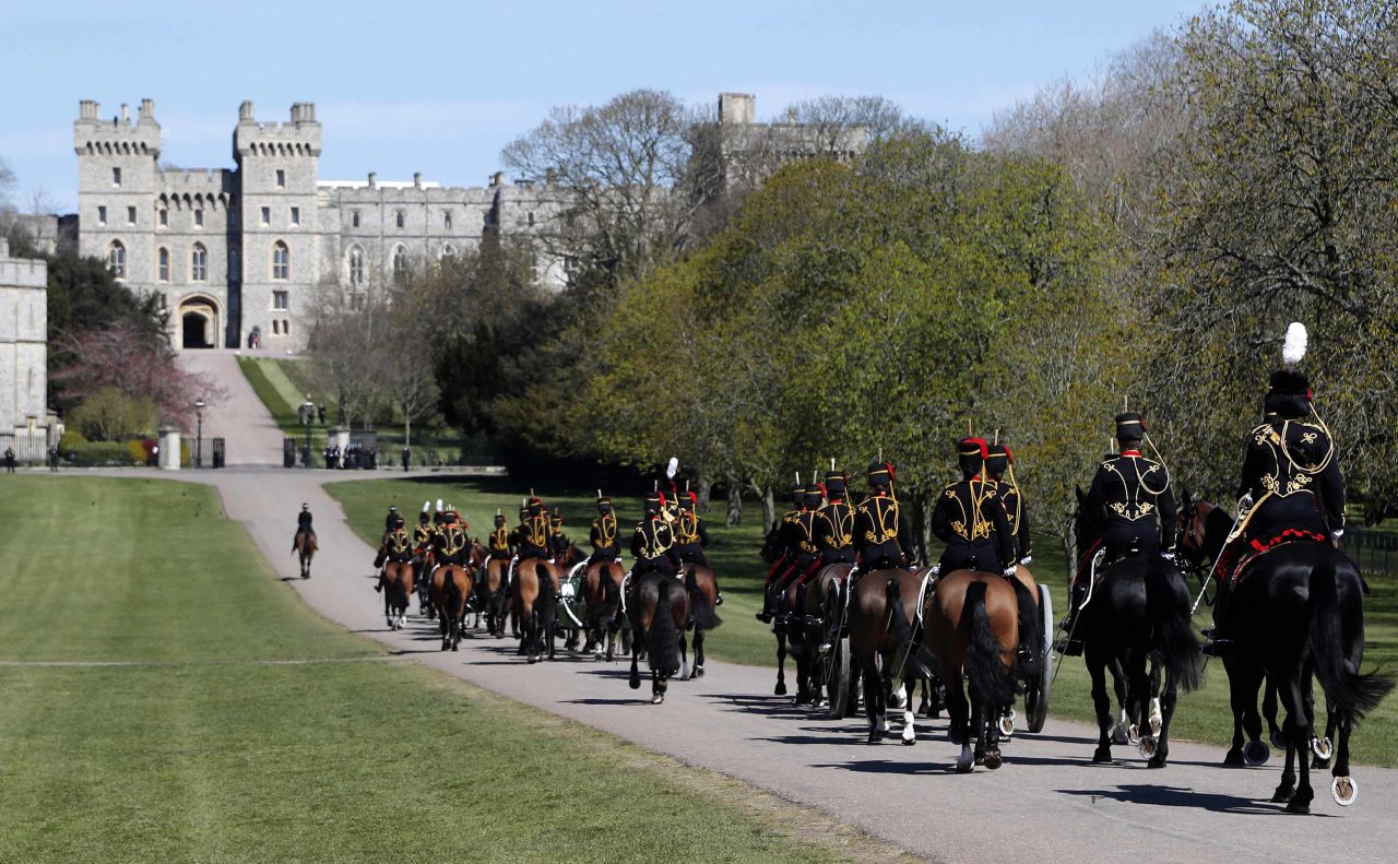 The King's Troop Royal Horse Artillery ride towards Windsor Castle in Windsor, England, on Saturday, April 17.