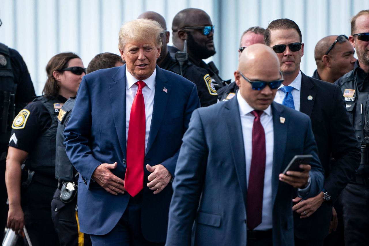 In this June 10 photo, former President Donald Trump and his aid Walt Nauta (right) arrive at an airport after Trump spoke at the Georgia Republican Party's state convention in Columbus, GA.  
