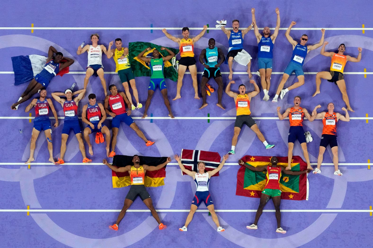 Decathletes lie on the track for a photo at the end of the last event on August 3. At bottom are silver medalist Leo Neugebauer of Germany, <a href="https://www.cnn.com/sport/live-news/paris-olympics-news-2024-08-03#h_9c00eb3c8d1e6ed8000070bcdc89745d">gold medalist Markus Rooth of Norway</a> and bronze medalist Lindon Victor of Grenada.