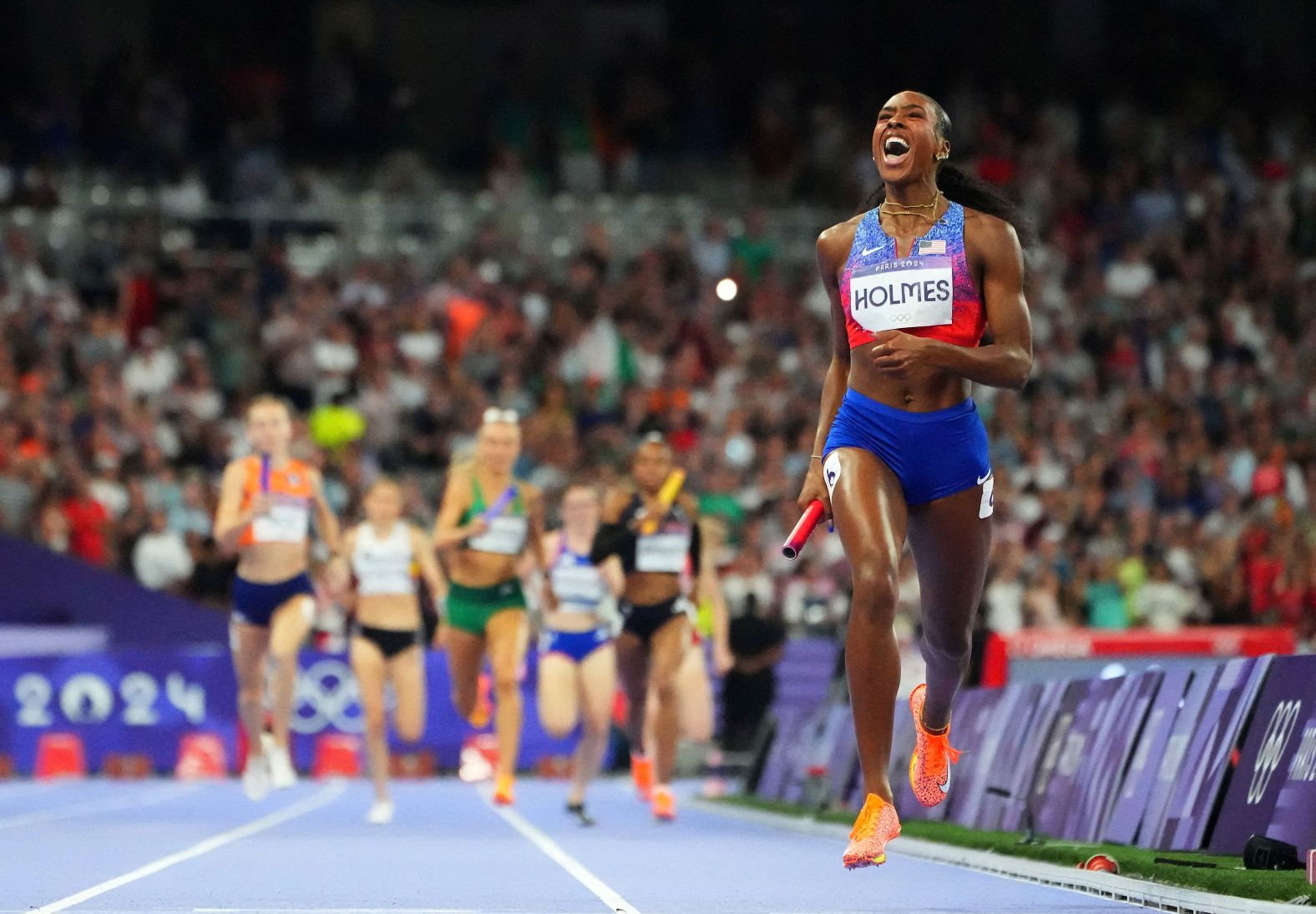 Alexis Holmes crosses the finish line to win gold for the United States in the <a href="https://www.cnn.com/sport/live-news/paris-olympics-news-2024-08-10#h_97964e08f95ff74e0bc68039d9a0f1a5">4x400 relay </a>on August 10. The United States finished a staggering 50 meters clear of the second-place team.