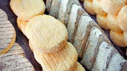 Detail of various types of traditional french cheese on the market in Paris