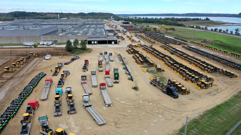 In this aerial view, construction and farming vehicles manufactured by John Deere are loaded onto trucks at the John Deere Dubuque Works facility on October 15, 2021 in Dubuque, Iowa.