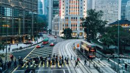 Pedestrians crossing street in Central Hong Kong, China