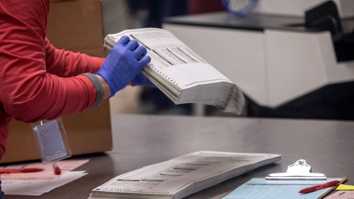 Election workers sort ballots at the Maricopa County Tabulation and Election Center on November 9, 2022 in Phoenix, Arizona.