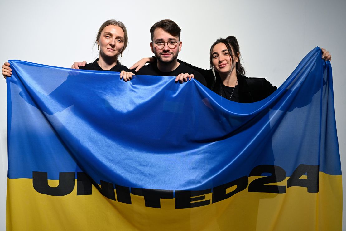 From left to right: Ksenia Schnaider, Ivan Frolov and Julie Paskal backstage ahead of the Ukrainian Fashion Week show during London Fashion Week in February 2023.