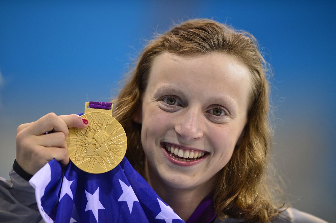 Katie Ledecky poses on the podium after winning gold in the women's 800m freestyle final at the London 2012 Olympics.