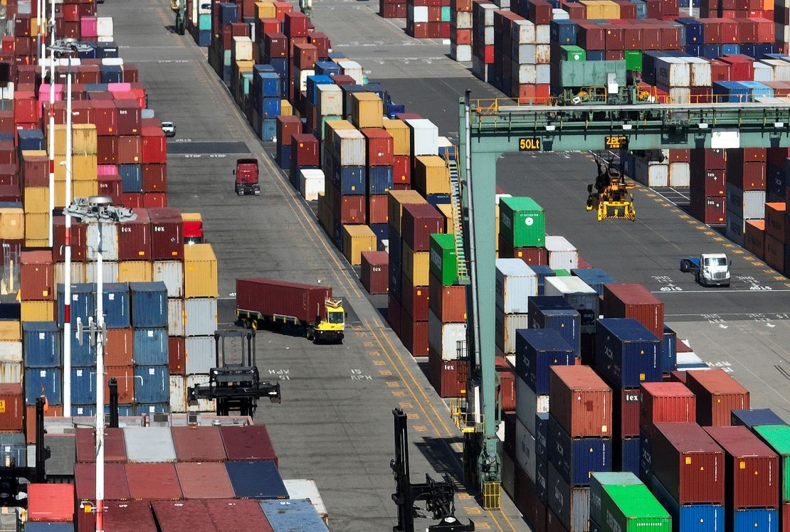 In an aerial view, shipping containers are seen stacked at the Port of Oakland on August 7, 2023, in Oakland, California.