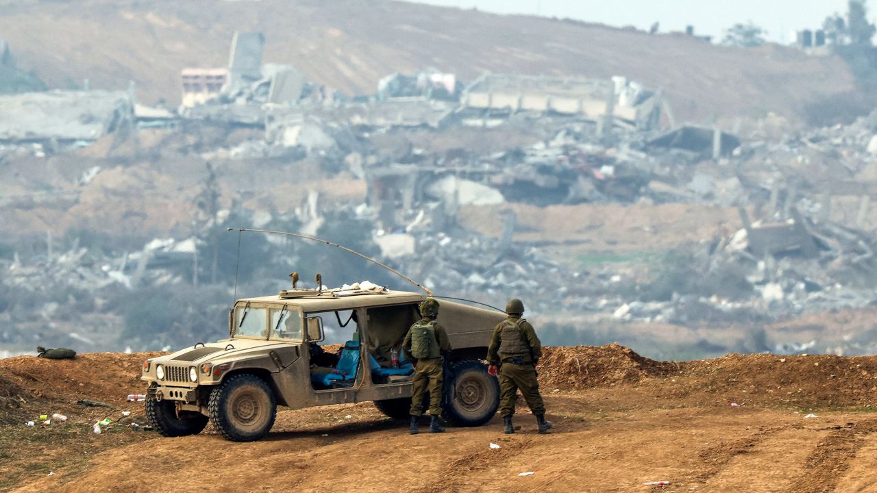 Israeli soldiers patrol along the Israel-Gaza border on December 27, 2023, amid ongoing battles between Israel and the Palestinian militant group Hamas.