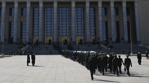 Military delegates arrive at the Great Hall of the People in Beijing to attend the closing session of the National Peoples Congress on March 11, 2024.
