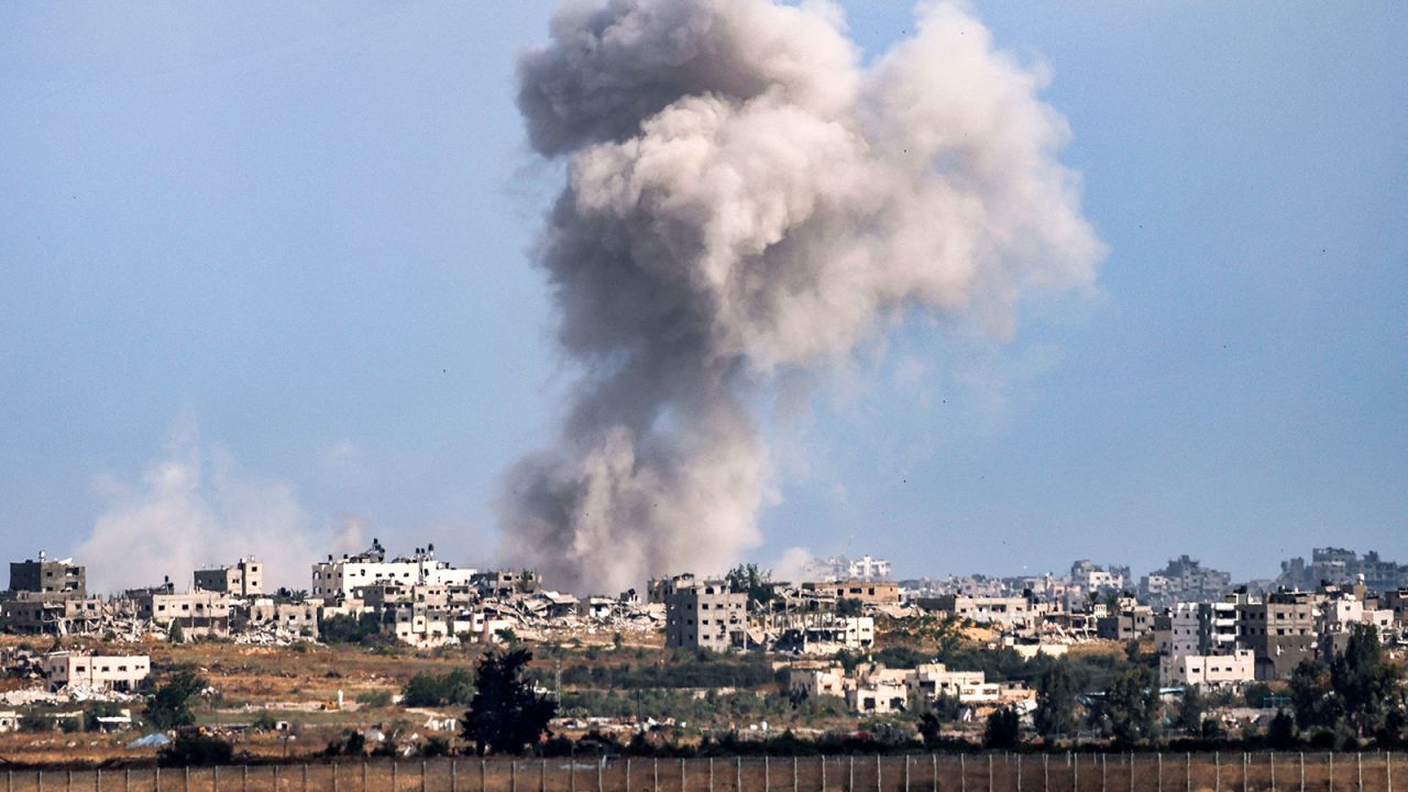 A smoke plume from an explosion billows in Gaza as seen from a position along Israel's southern border with the Palestinian territory on May 13, 2024 amid the ongoing conflict between Israel and the militant group Hamas. (Photo by JACK GUEZ / AFP) (Photo by JACK GUEZ/AFP via Getty Images)