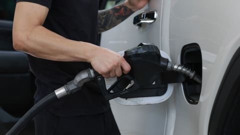 A customer gets gas at a Shell station on May 15, 2024 in Miami, Florida.