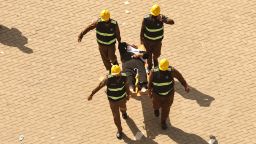 Rescuers carry away a man affected by the scorching heat on a stretcher during the Hajj pilgrimage on June 16.