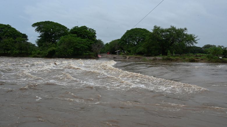 View of the flooding of the Goascaran river in El Cubulero community, La Alianza municipality, Valle department, Honduras, on June 21, 2024, after heavy rains. Torrential rains across Central America have left at least 27 dead in landslides and flooding over the past week, mainly in El Salvador, but also in Guatemala and Honduras, officials said Friday. (Photo by Orlando SIERRA / AFP) (Photo by ORLANDO SIERRA/AFP via Getty Images)