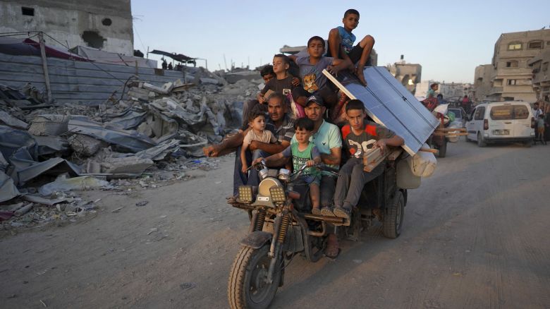 TOPSHOT - Displaced Palestinians leave an area in east Khan Yunis after the Israeli army issued a new evacuation order for parts of the city and Rafah, in the southern Gaza Strip on July 1, 2024, amid the ongoing conflict between Israel and the Palestinian Hamas militant group. (Photo by Bashar TALEB / AFP) (Photo by BASHAR TALEB/AFP via Getty Images)
