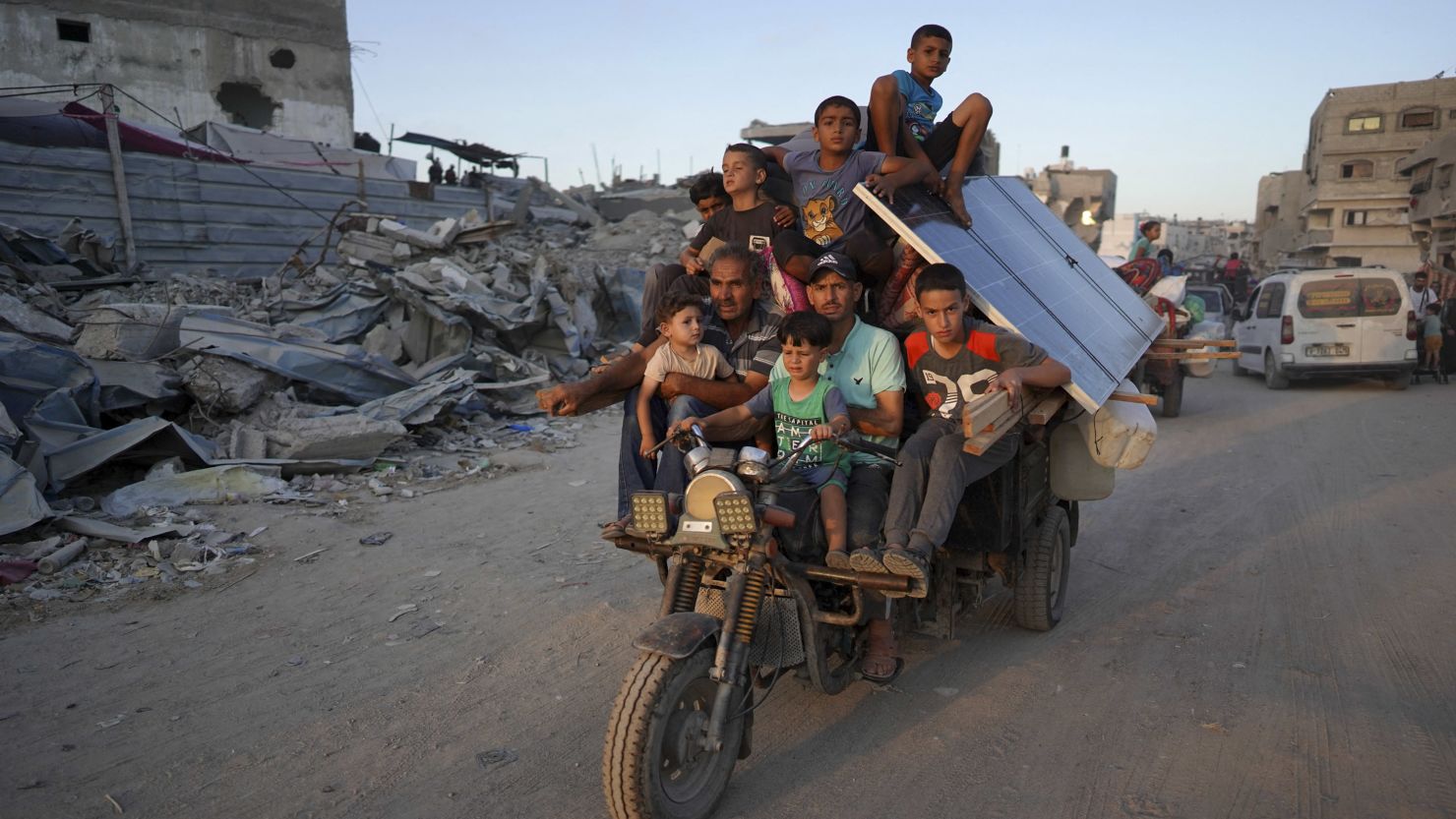 Displaced Palestinians leave an area in east Khan Younis after the Israeli army issued a new evacuation order for parts of the city and Rafah, in the southern Gaza Strip on Monday.