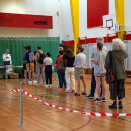 People queue to cast their vote in the second round of the parliamentary elections on July 7, 2024 in Paris, France.