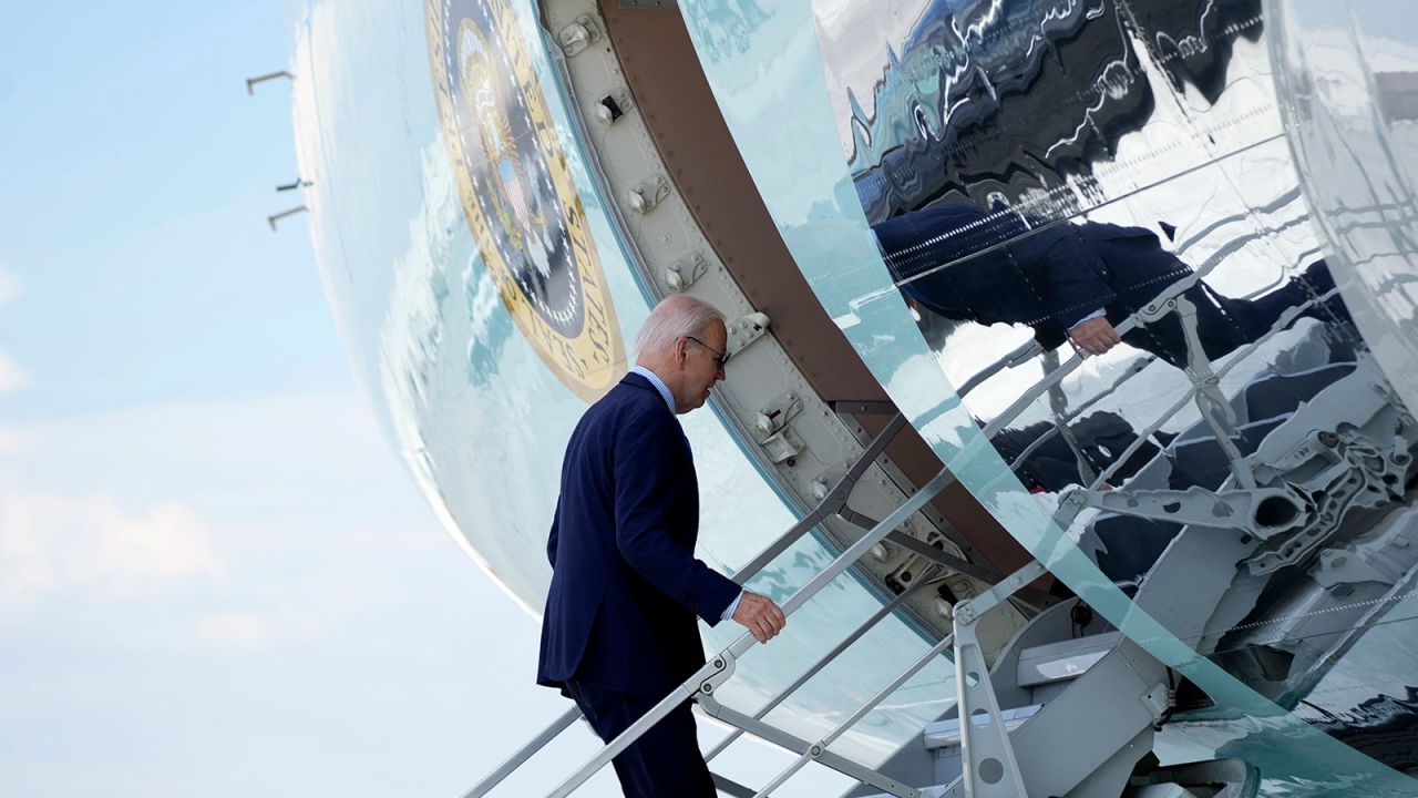 US President Joe Biden boards Air Force One as he departs Harry Reid International Airport in Las Vegas, Nevada, on July 17, 2024, en route to Delaware. US President Joe Biden is experiencing "mild symptoms" after testing positive for Covid during a campaign trip to Las Vegas on Wednesday, the White House said. (Photo by Kent Nishimura / AFP) (Photo by KENT NISHIMURA/AFP via Getty Images)