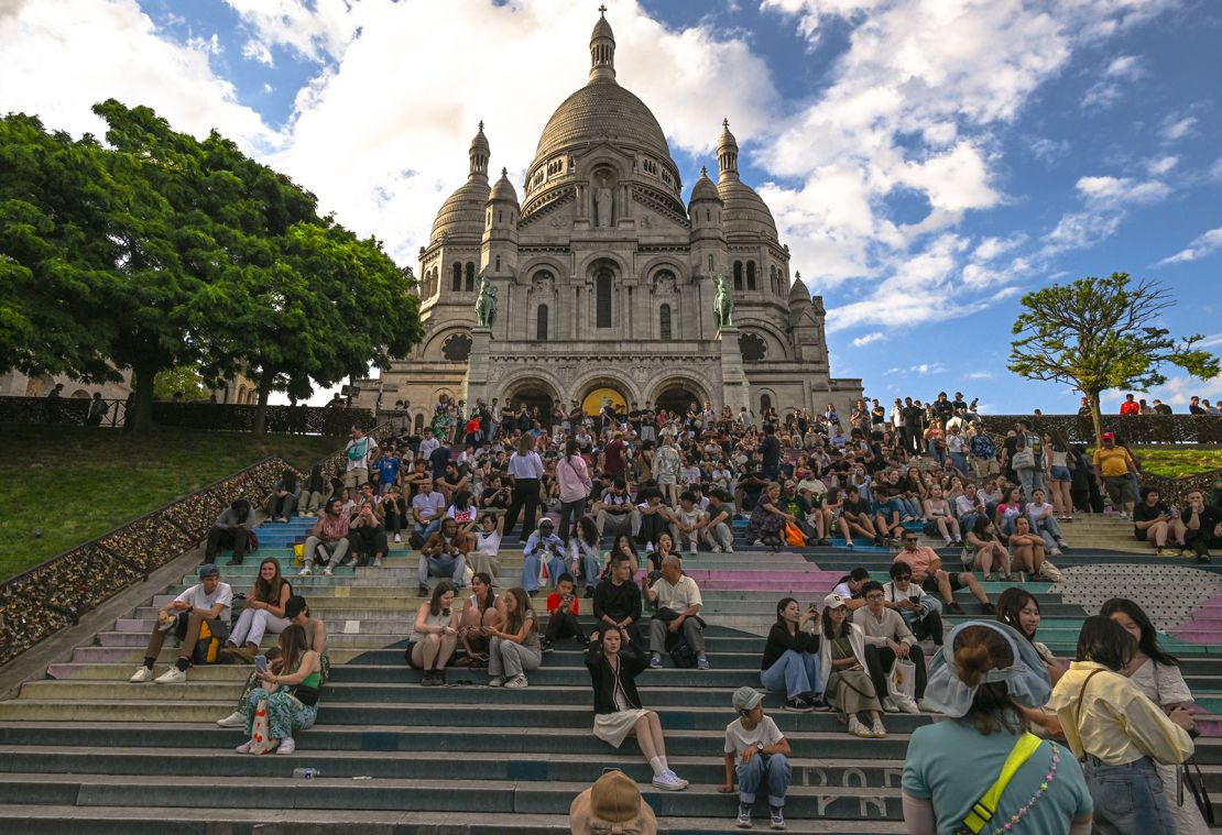 When visiting places of worship, such as the Sacré-Cœur, be respectful in your behavior and dress.