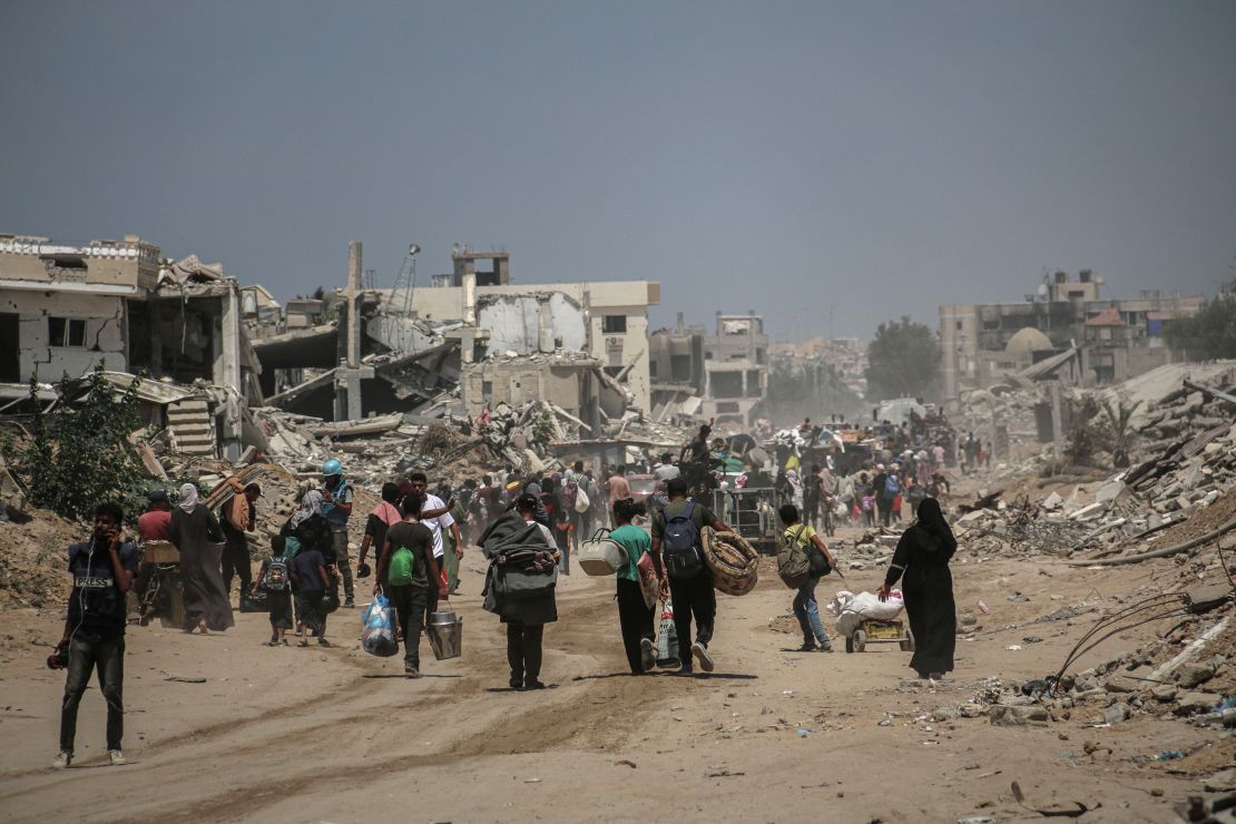 Displaced Palestinians leave the eastern neighborhoods following Israeli military orders to evacuate parts of the city in Khan Younis, southern Gaza, on Monday, July 22, 2024. The Israeli military ordered civilians to leave parts of the Gazan city of Khan Younis due to a renewed assault against Hamas, even as it reduced the size of an already overcrowded humanitarian zone where they could potentially take shelter. Photographer: Ahmad Salem/Bloomberg via Getty Images