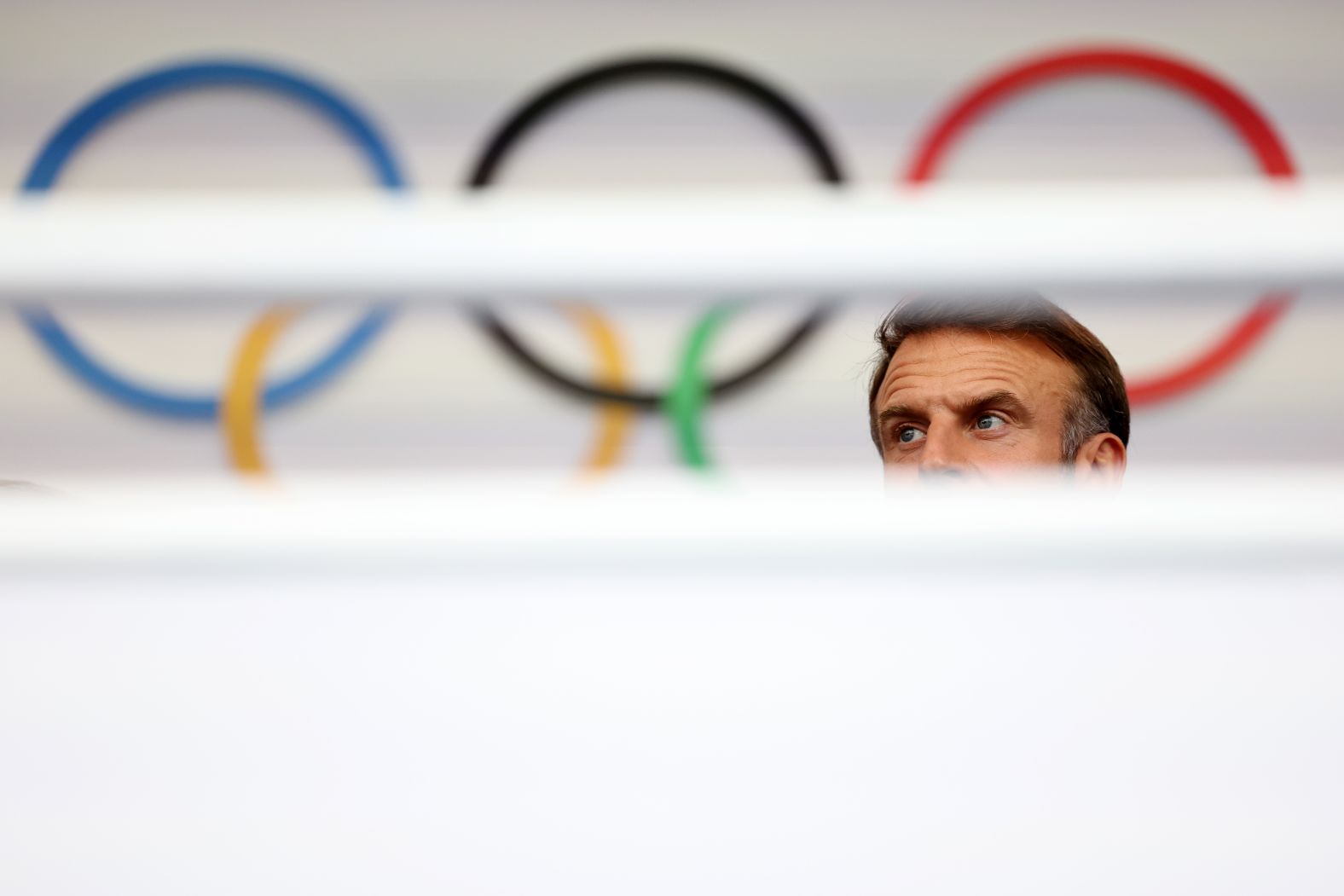 French President Emmanuel Macron looks on before the ceremony.