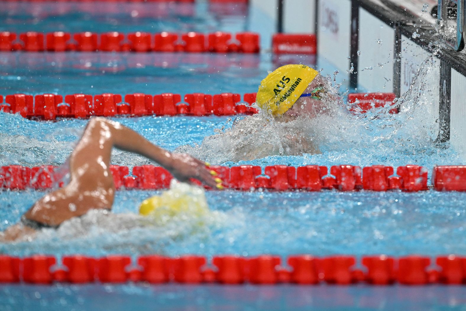 Mollie O'Callaghan beats fellow Australian Ariarne Titmus to the wall <a href="https://www.cnn.com/sport/live-news/paris-olympics-news-2024-07-29#h_0aaaff0ff5b036add4d10a8d8b387ce5">to win the 200-meter freestyle</a> on July 29. O'Callaghan finished in 1:53.27, topping Titmus’ Olympic record from three years ago. Titmus won the silver.