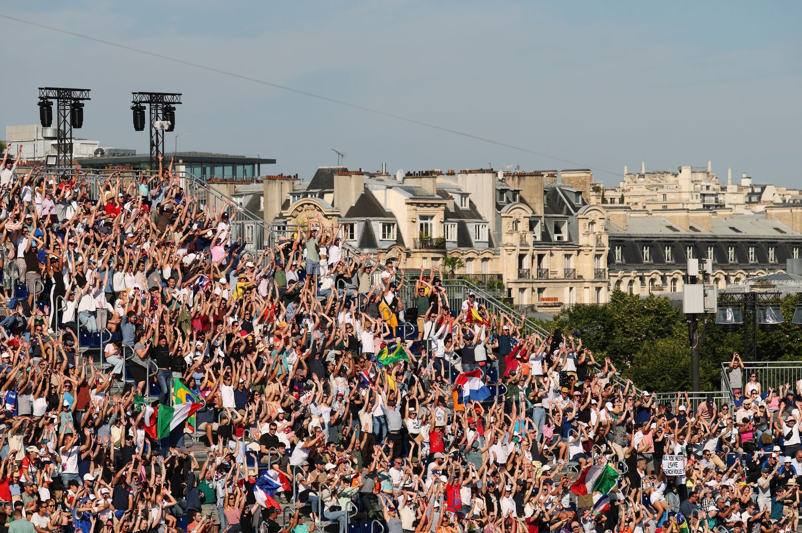 Fans show their support during a beach volleyball match on July 28.