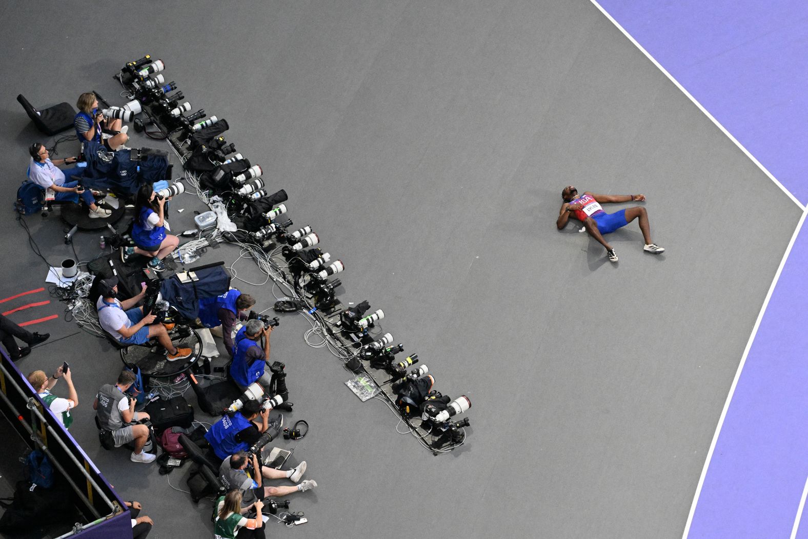 US sprinter Noah Lyles lies on the ground after the 200 meters. Lyles, who was diagnosed with Covid-19 earlier this week, <a href="https://www.cnn.com/sport/live-news/paris-olympics-news-2024-08-08#h_1b942b7f22396e593eaca67ec4816857">required assistance from medical personnel</a>. He said he was feeling light-headed after the race and that he also was experiencing chest pain and shortness of breath. He was later able to give television interviews.