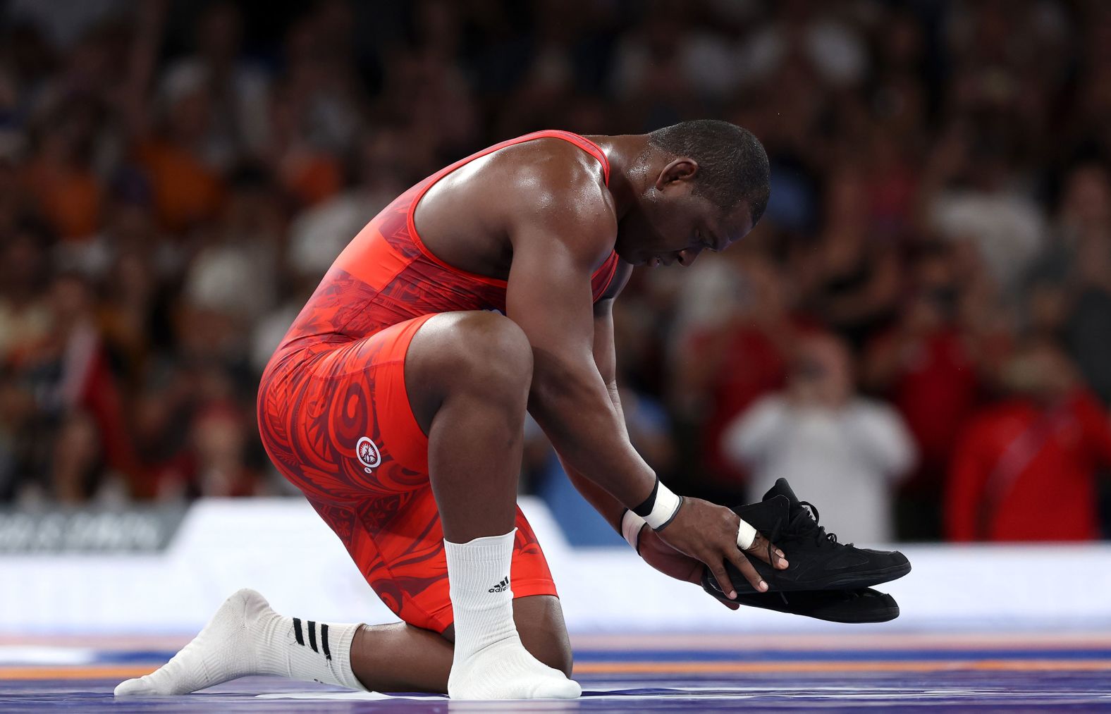 Cuban wrestling great Mijaín López leaves his shoes on the mat, signifying his retirement, after <a href="https://www.cnn.com/sport/live-news/paris-olympics-news-2024-08-06#h_5a21493bb1425e3f42c25fd5ac99f27a">he won his fifth Olympic gold medal</a> on August 6. He dominated Chile’s Yasmani Acosta in the 130-kilogram final and became the first Olympian in history to win five gold medals in the same individual event.