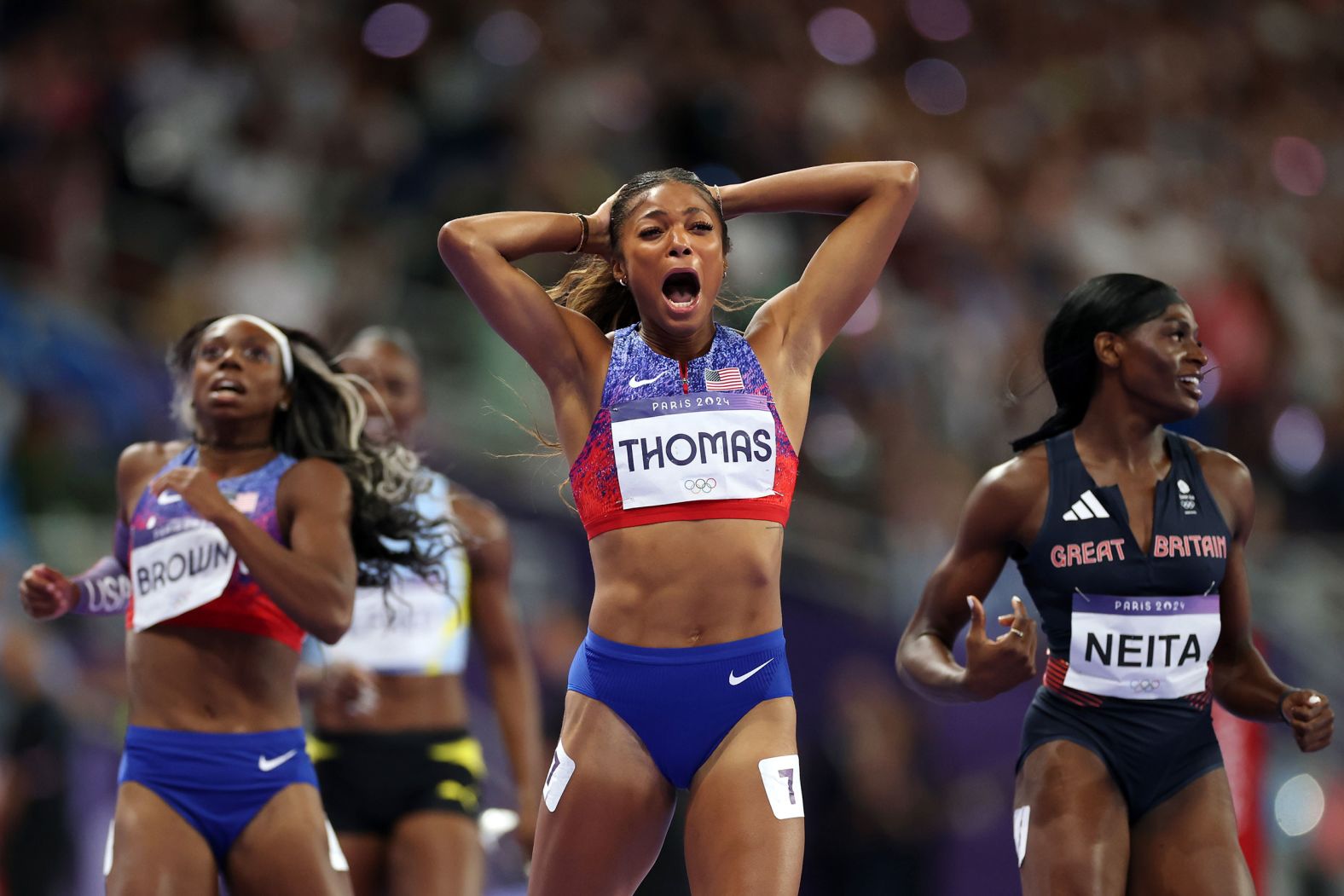 US sprinter Gabby Thomas celebrates after <a href="https://www.cnn.com/sport/live-news/paris-olympics-news-2024-08-06#h_bbdc8465fbc82c1ff9804014f0fffd9f">winning the 200 meters</a> on August 6.