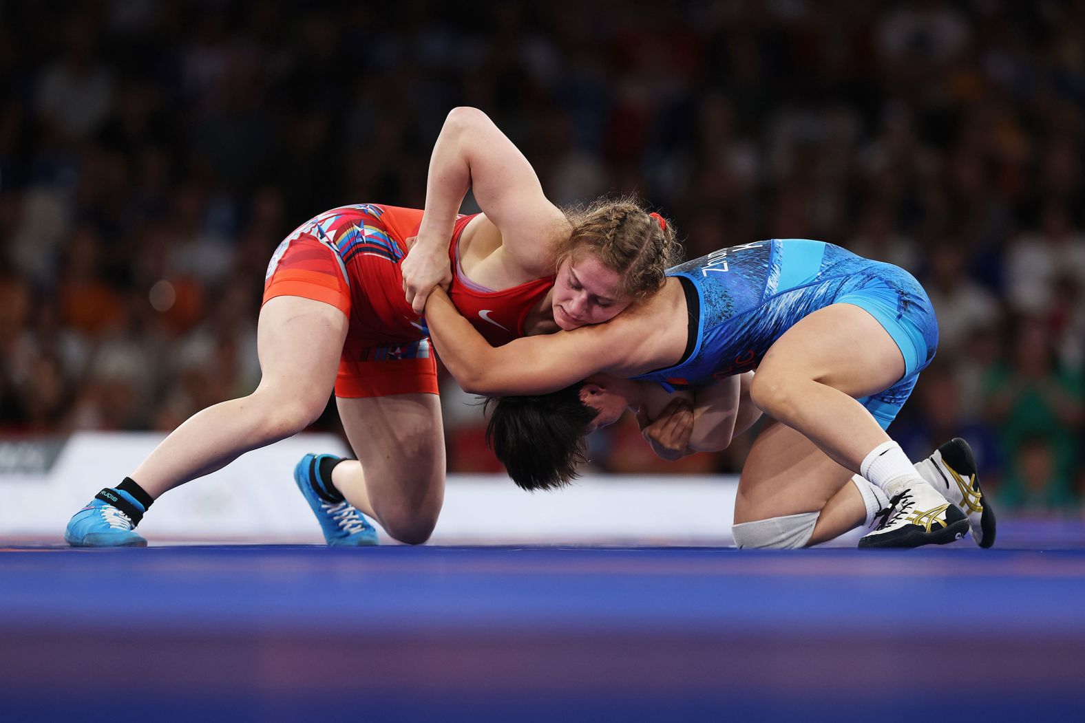 The United States' Amit Elor, left, wrestles Kyrgyzstan's Meerim Zhumanazarova in the 68-kilogram final on August 6. <a href="https://www.cnn.com/sport/live-news/paris-olympics-news-2024-08-06#h_aa31c5c75fce4cc3d925b9b65fdb2140">Elor won the gold medal</a>.