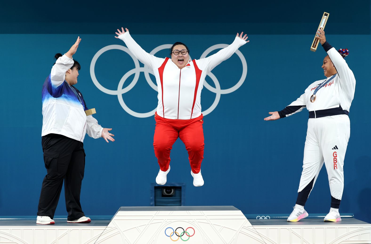 Chinese weightlifter Li Wenwen <a href="https://www.cnn.com/sport/live-news/paris-olympics-news-closing-ceremony#h_6be95af213728fb8b857a5178a0fa292">celebrates winning gold</a> in her weight class on August 11. She also won gold in the event three years ago. South Korea's Park Hye-jeong, left, finished with the silver, and Great Britain’s Emily Campbell earned bronze.