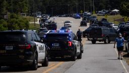 Law enforcement and first responders control traffic after a shooting took place at Apalachee High School in Winder, Georgia, on September 4, 2024. Police took a suspect into custody after the shooting on Wednesday, with students evacuated from the scene and local media reporting fatalities. CNN, citing unnamed law enforcement sources, reported that four people had been killed and 30 wounded. Other outlets reported two deaths. (Photo by CHRISTIAN MONTERROSA / AFP) (Photo by CHRISTIAN MONTERROSA/AFP via Getty Images)