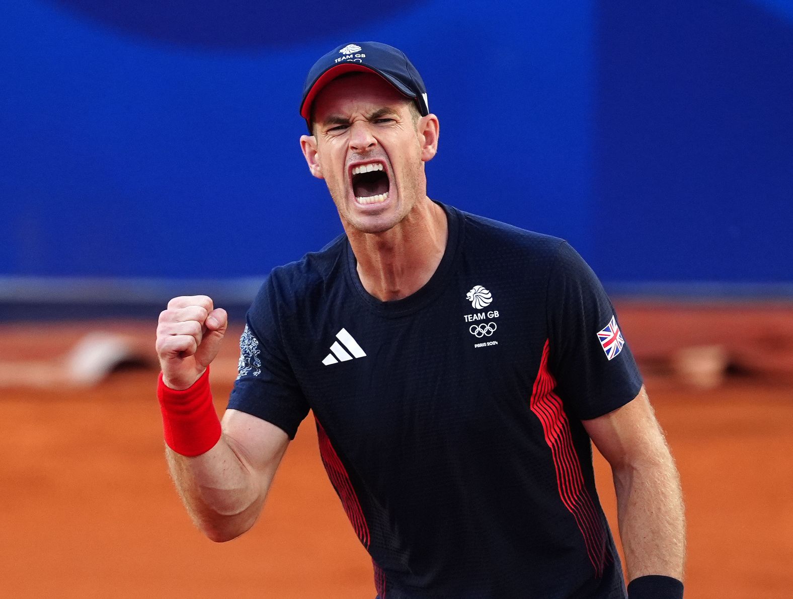 Great Britain’s Andy Murray reacts after he and doubles partner Dan Evans came back to defeat Japan’s Taro Daniel and Kei Nishikori in a second-round match at the Olympics on July 28. <a href="https://www.cnn.com/sport/live-news/paris-olympics-news-2024-07-28#h_f94470e3d0fbb81377b941341ccb1f91">They fought off five match points</a> to win 2-6, 7-6, 11-9. Murray has said he will retire after the Games.