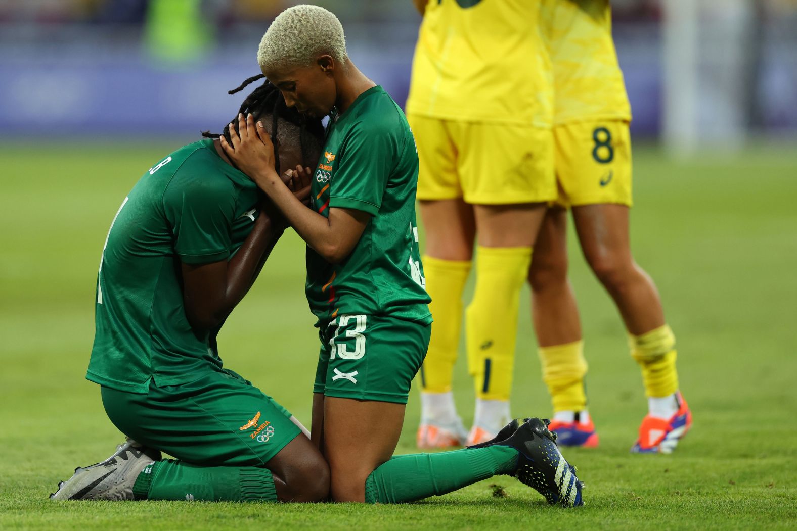 Zambia's Martha Tembo consoles teammate Barbra Banda after Australia <a href="https://www.cnn.com/sport/live-news/paris-olympics-news-2024-07-28#h_7e5e7a0aa09e904a647abd3da1c31ac9">came back from a 5-2 deficit to win 6-5</a> in their soccer match on July 28.